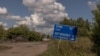 Ukrainian servicemen drive an armoured military vehicle on a road towards the border with Russia, in the Sumy region of Ukraine, on August 14, 2024.